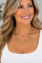 Smiling Model in Chunky Gold Necklace Gold-Tone Oval Link Statement Necklace
